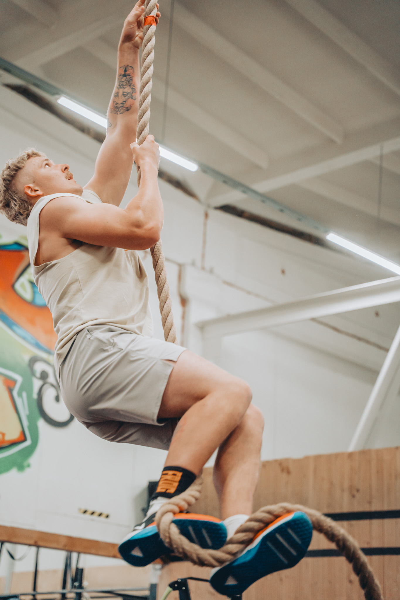 Athlete climbing rope during CrossBear